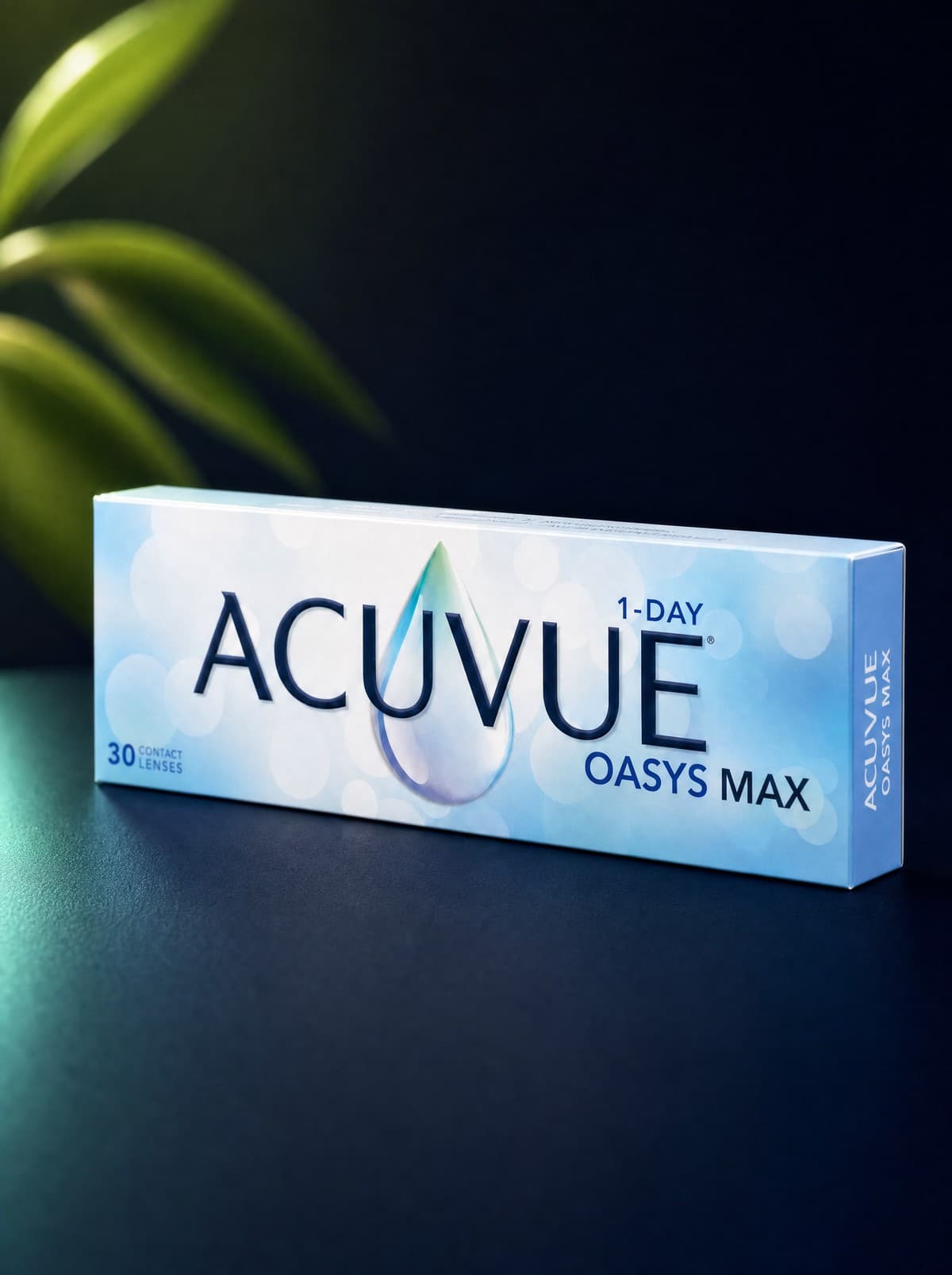 A box of ACUVUE Oasys Max 1-Day contact lenses on a dramatic dark navy gradient surface, with a softly backlit green leaf in the background